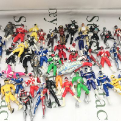 A Box Containing Playworn Power Rangers And VR Trooper Figures. Morphers. Bikes Etc. No Reserve.