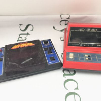 A Entex Electronics Defender And A Tomy Astro Blaster.