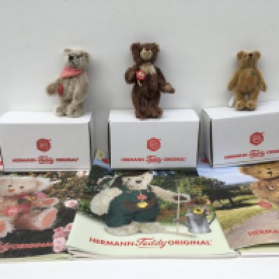 Three boxed minature Herman teddy bears given as a gift to club members. Includes 2003 a 12cms light brown ..2004 11cms golden brown..2011 13cms dark brown with light chest. No reserve