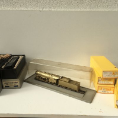 A Collection of OO..HO gauge model railway including boxed locomotive and Tender by Tenshodo and 5x boxed rolling stock by Accurail. Also includes Golden Rivarossi loco and tender in display case. No reserve