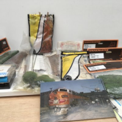 A collection of model railway accessories including track..scenery..picture cards and Air brush set. No reserve.