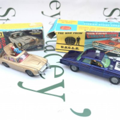 A Boxed Corgi James Bond Aston Martin DB5 #261 (No Envolope) And A The Man From Uncle Thrush Buster (No Ring) Both plinths Missing Boxes Worn.