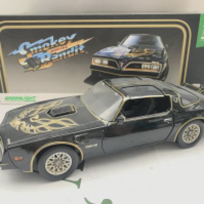 A 1/18 Scale Greenlight 1977 Pontiac Firebird From Smokey And The Bandit.