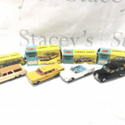 4 X Boxed Corgi Vehicles. A Plymouth Sorts Suburban #219 A Chevrolet New York Taxi Cab #221. A Ford Thunderbird-Open Sports #215 And A Austin Taxi #418. Boxes Are Worn. Cars Are Playworn. No Reserve.