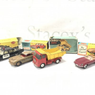 3 X Boxed Corgi And 1 X Dinky Boxed Diecast. All Playworn And Boxes Are Worn. Including A U.S.A Police Car #258. A Aston Martin DB4 #218. A ERF Model 64G Earth Dunper #458 And A E Type Jaguar #307 (Hard Top Missing). No Reserve.