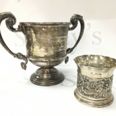 Silver hallmarked trophy and a Silver Embossed Birds & Foliage Vase / Beaker. Postage category B