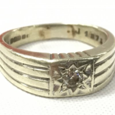 A 9ct white gold ring set with a small diamond stone, size O. Total weight 4.6g. postage category A