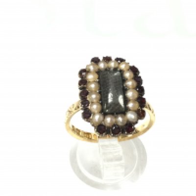 An 18ct pearl and ruby mourning ring. 5.75g and size P 1/2