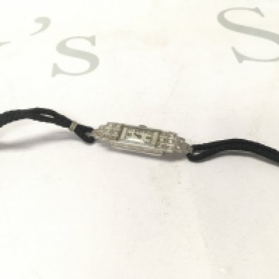 A 1930s platinum and diamond cocktail watch.