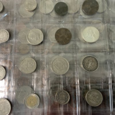 An Album of varied world coinage. NO RESERVE