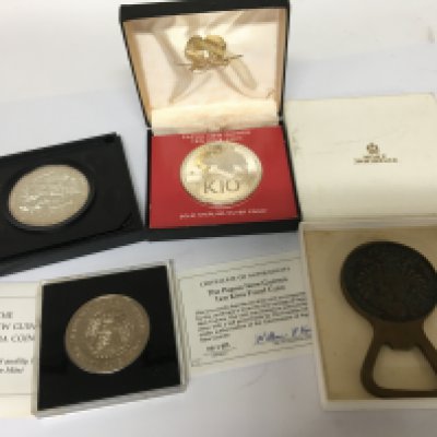 A silver commemorative coin 148-1973 Netherlands Antilles a K10 silver Papua New Guinea Coin silver wedding anniversary coin and a coin bottle opener and silver centenary of the horse tram (5). NO RESERVE