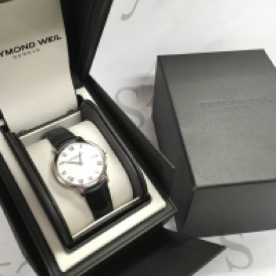 A boxed as new Gents Raymond Weil watch. Postage category b