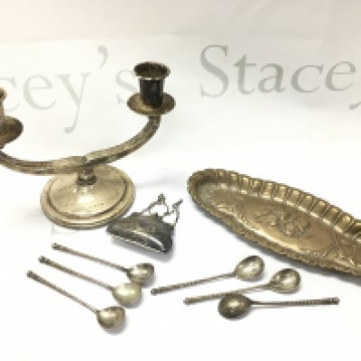 A collection of silver hallmarked items including a candle stick, cherub tray , coffee spoons and a purse. Postage category B