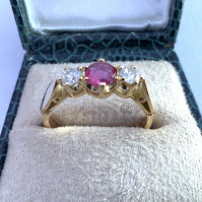 Vintage 18ct yellow gold 3 stone ruby and diamond ring with stylish box. RBC diamonds 0.34ct. R/C ruby 0.58ct. Postage category A.