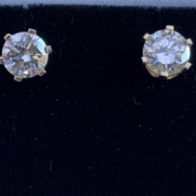 Pair of 14ct yellow gold RBC diamond solitaire studs, boxed. Diamonds 1.40ct. Postage category A.