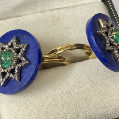 Unusual lapiz lazuli, diamond and emerald silver gilt starburst cufflinks, boxed. Disc shaped lapiz lazuli, 16.20ct. Round cabochon emeralds 0.78ct. Rose cut diamonds 0.42ct. Postage category A.
