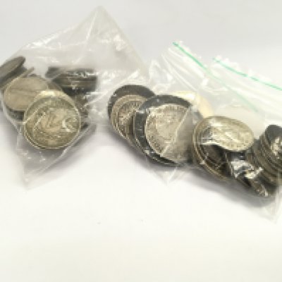A collection of silver British coins.