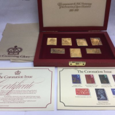 A sterling silver and gold plated Commemorative stamp set for the 25th anniversary of the coronation of Queen Elizabeth II. Shipping category B.