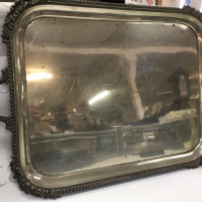 A large 2 handled hallmarked silver serving tray from Goldsmiths and Silversmiths, London 1909 , 64cm wide x 40cm long. Total weight 3.1kg .Postage category C.