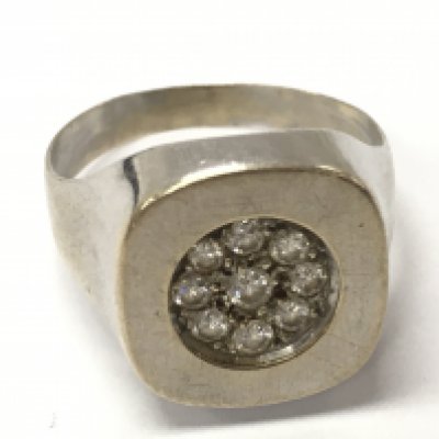 An unmarked silver gents diamond signet ring , size P, 3.9g total weight. Postage category A