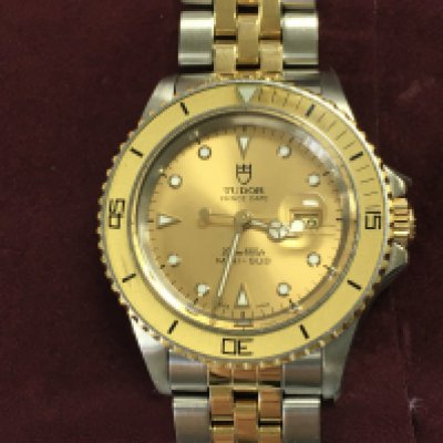 A Tudor prince date mini sub two tone watch. 33mm case with box and paperwork. Watch seen running and have service / repair paperwork late 2024 early 2025. Watch is still stickered from this. Postage B
