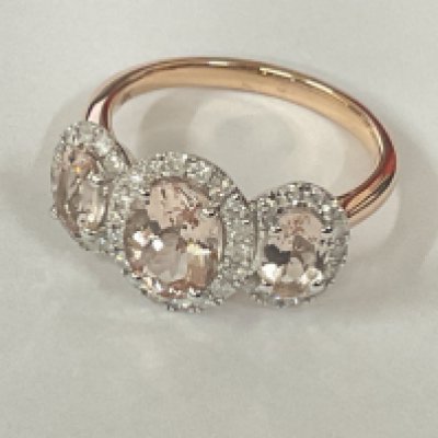 9ct rose gold oval morganite and RBC diamond cluster ring. Morganite 0.67ct. Diamonds 0.26ct. Postage category A.