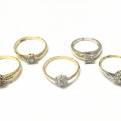 An 18ct gold diamond cluster ring, 16g total weight. postage category A