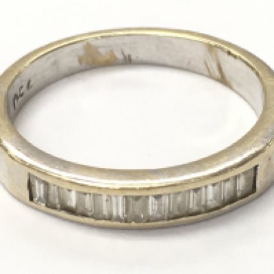 a 18ct white gold baguette diamond 1/2 hoop ring, size N. 3.7g Postage category A