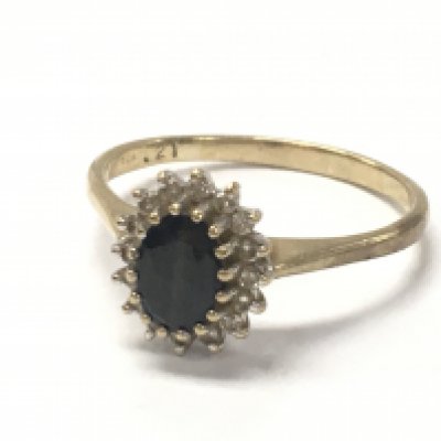 A 9ct gold sapphire and diamond cluster ring, 2.6g. Postage category A