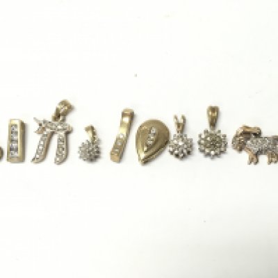 9 carat gold and diamond set pendants , Total weight 10.9g. Postage category a
