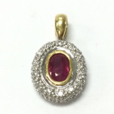 An 18ct gold ruby and diamond cluster pendant 2.49g. Postage category A