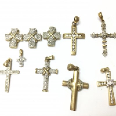 9ct gold mixed diamond crosses , 13.1g total weight. Postage category A