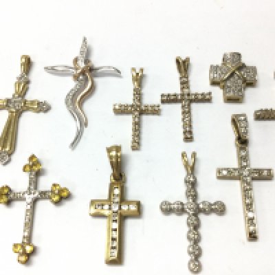 9ct gold cross pendants set with diamond stones , 11.9g total weight. Postage category A
