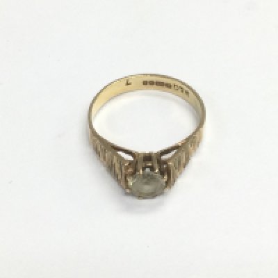 A 9ct gold ring set with a central CZ, approx size K-L and approx 1.8g. Shipping category A.