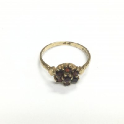 A 9ct gold garnet cluster ring, approx size O and approx 2g. Shipping category A.