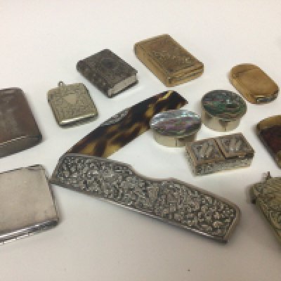 A silver cased comb small silver box Serling silver match case and a collection of brass and silver plated vestas.