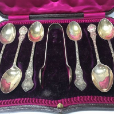 A cased set of six silver spoons and tongs together with cased shell salts and six plated spoons.