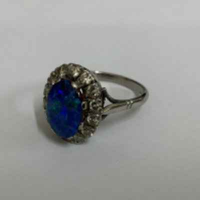 An 18ct white gold Opal and Diamond ring. Q.5