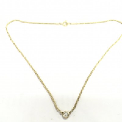 An unmarked yellow metal choker snake chain with stone set pendant, total weight 5.4g postage category A