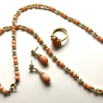 A gold coral and seed pearl necklace together with a 14ct gold coral and stone set ring and a pair of 9ct gold and coral drop earrings. (A)