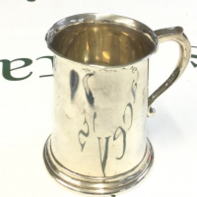 A silver mug ,9.5cm tall. Postage category B