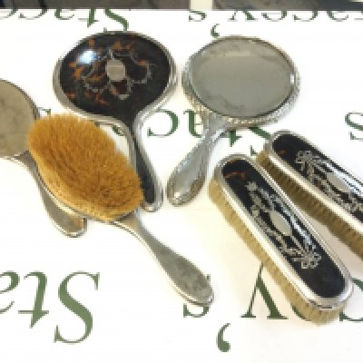 A silver and tortoiseshell dressing set including mirrors and brushes. This lot cannot be posted