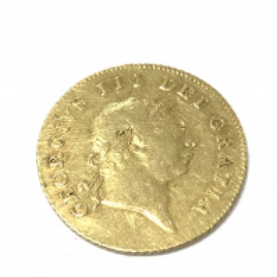 A 1806 George III half guinea laureate head and shield in garter. 4.18g Postage A