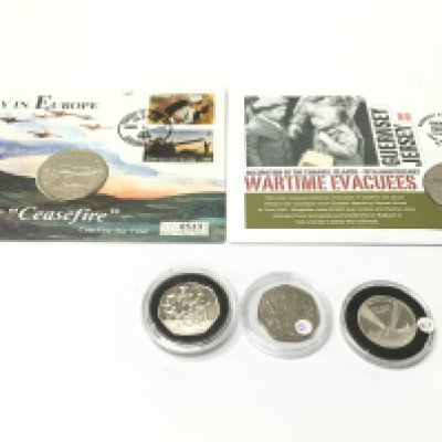 A silver proof 50p and two coin first day covers. Postage A