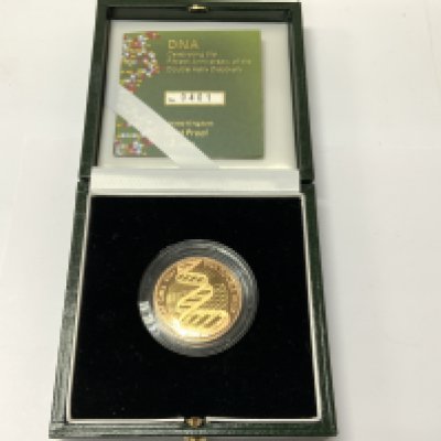 A 2003 50th anniversary double helix proof gold 2 pound coin. Issued by royal mint. 401 /1500. Postage category A.
