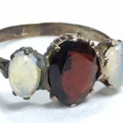 A 9 carat Moonstone and garinet ring, size O, weight 2.2g. Postage category A