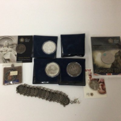 A coin bracelet a silver one ounce Britannia coin and other coins including 1890 Victorian crown.