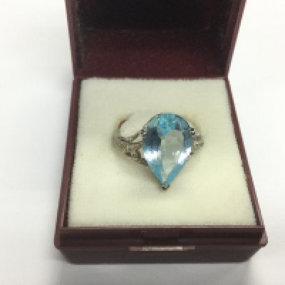 A 10k white gold ring set with a topaz, approx 4g and approx size M. Shipping category A.