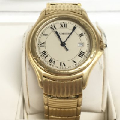 A cased Cartier Cougar yellow metal 18ct watch, Serial number 11651C44259. (seen working)