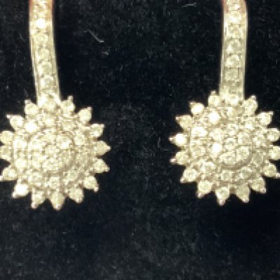 A pair of 9ct white gold diamond earrings. Postage category A.
